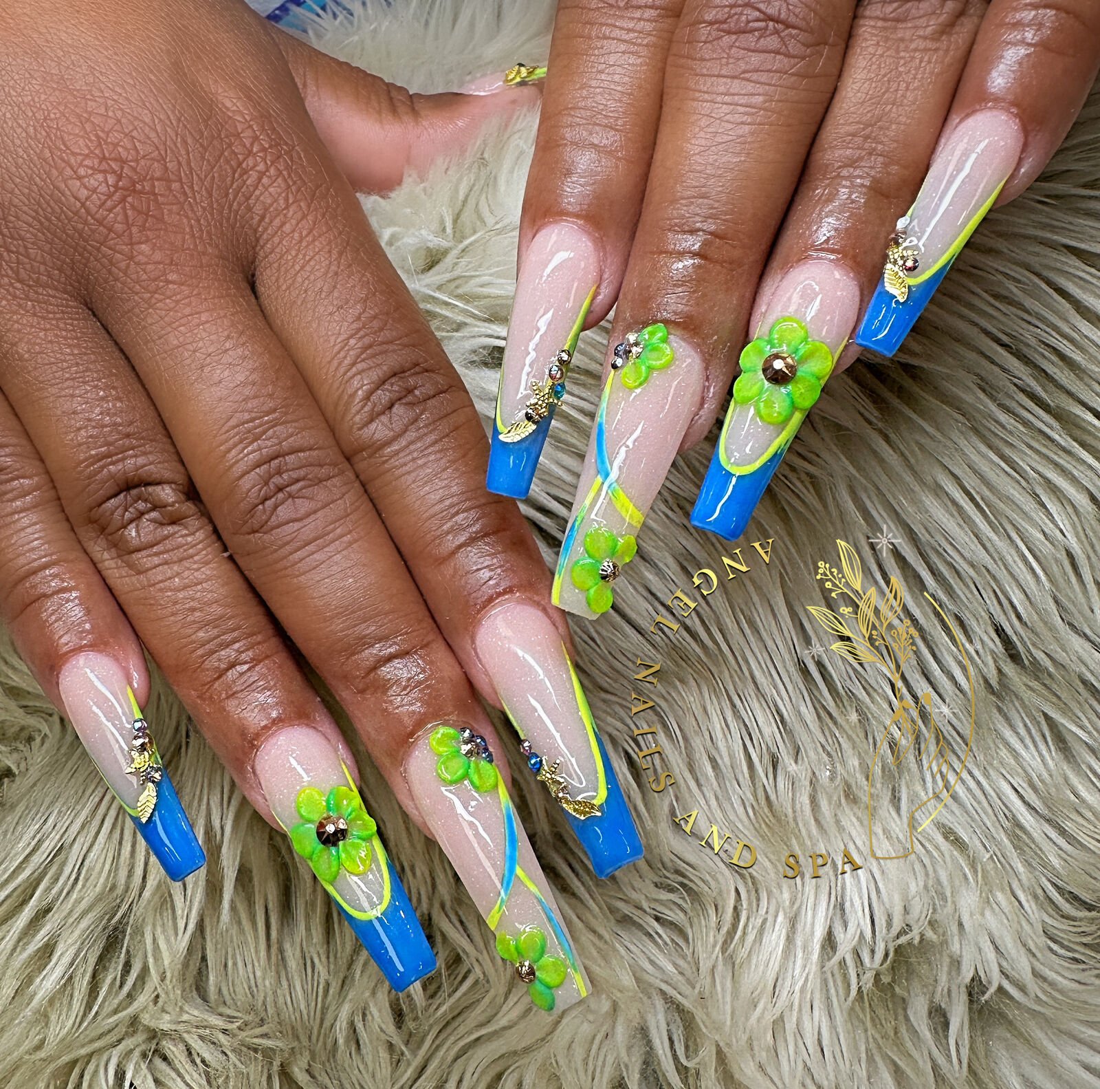Blue French tips with green 3D flowers and gold charms